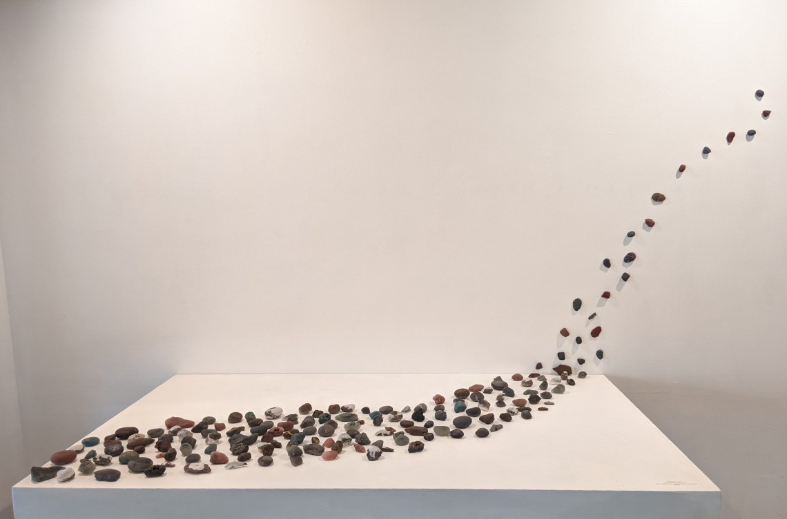Stones displayed on table and wall